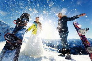 bride and groom in love throw snow background of the Alps Courchevel
